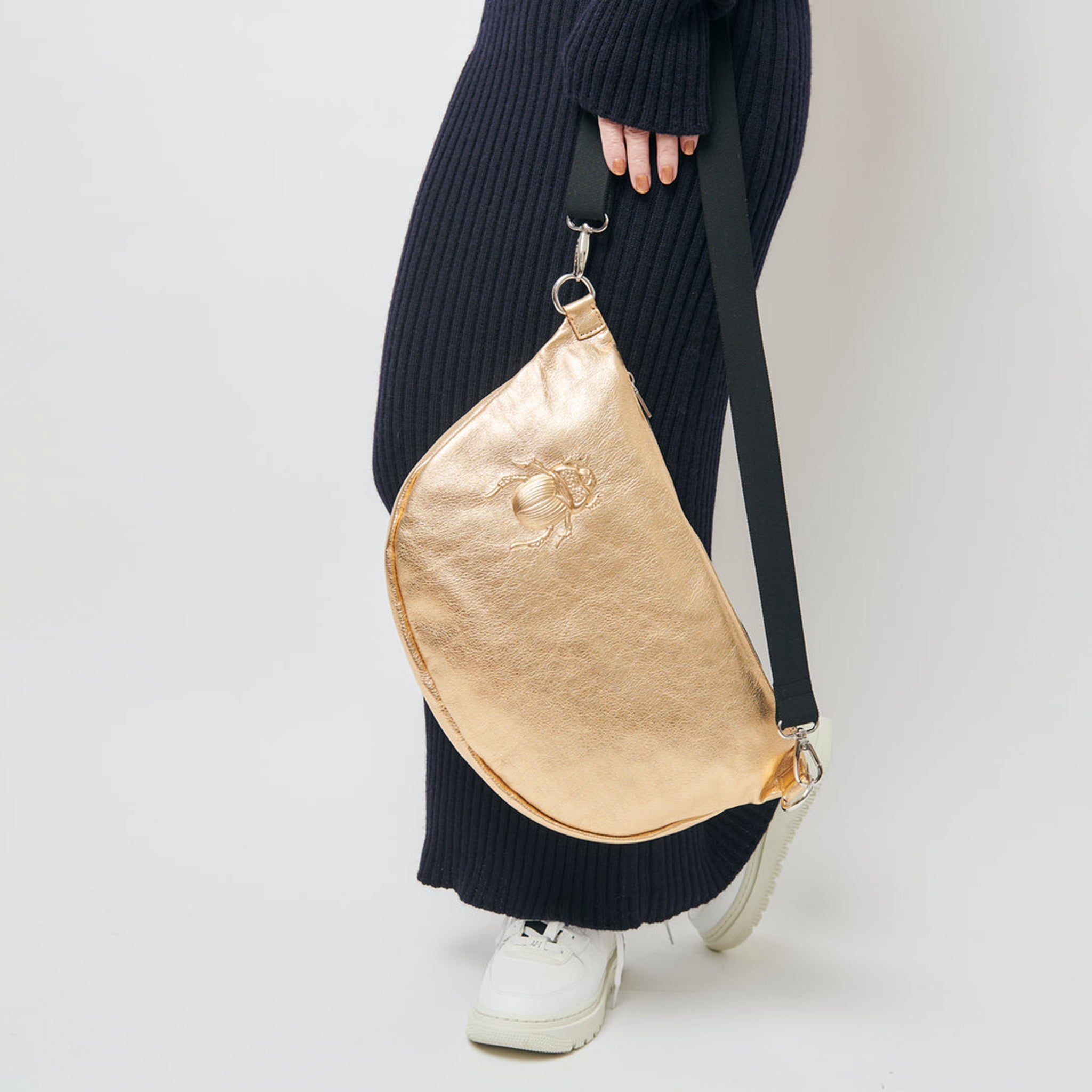 Model-holding-a-Metallic-Gold-