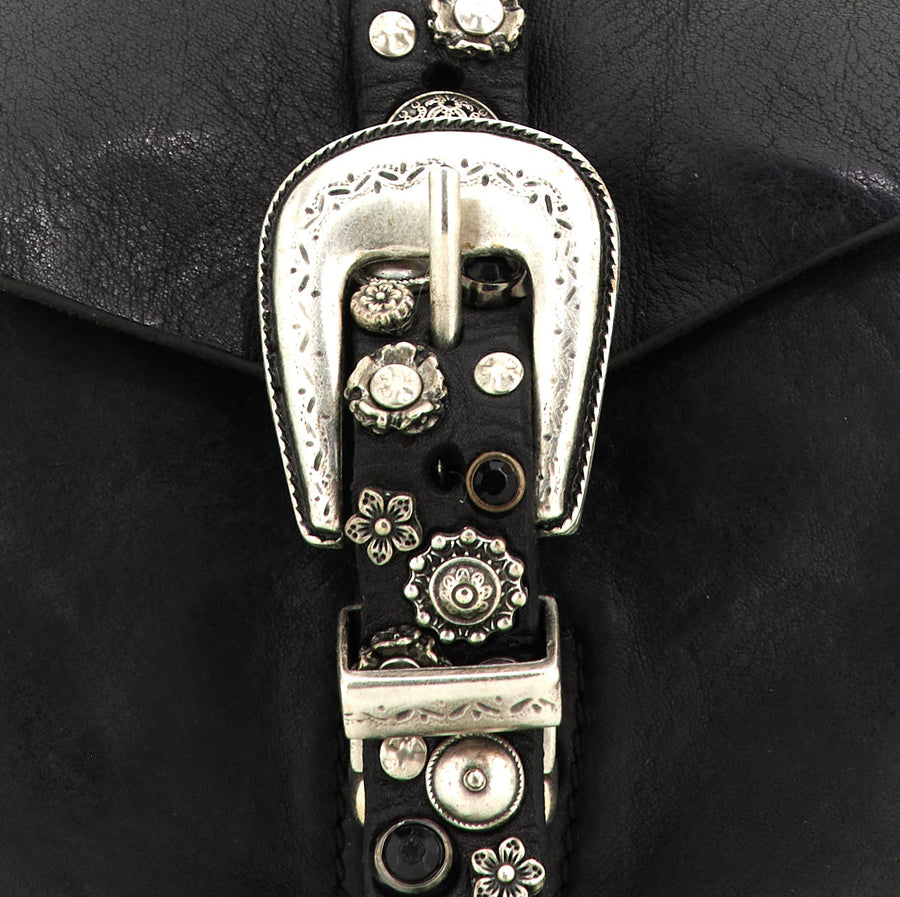 Melita Cross-body bag in black garment-dyed cowhide leather with flower studs