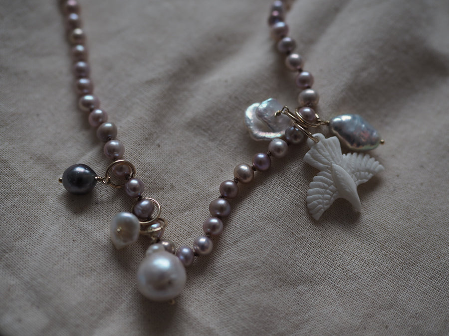 Pink Pearls With Hawk And Pearl Charms