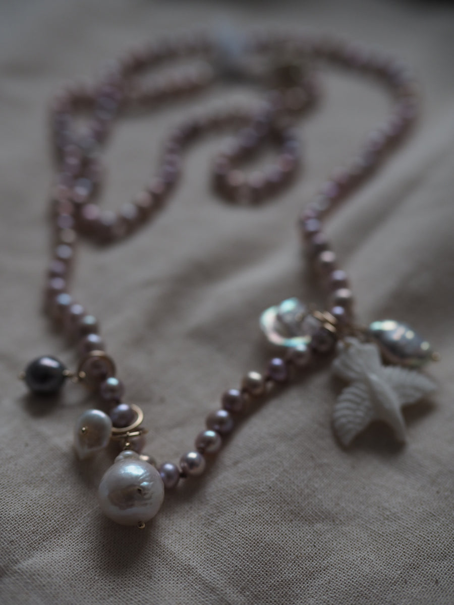 Pink Pearls With Hawk And Pearl Charms