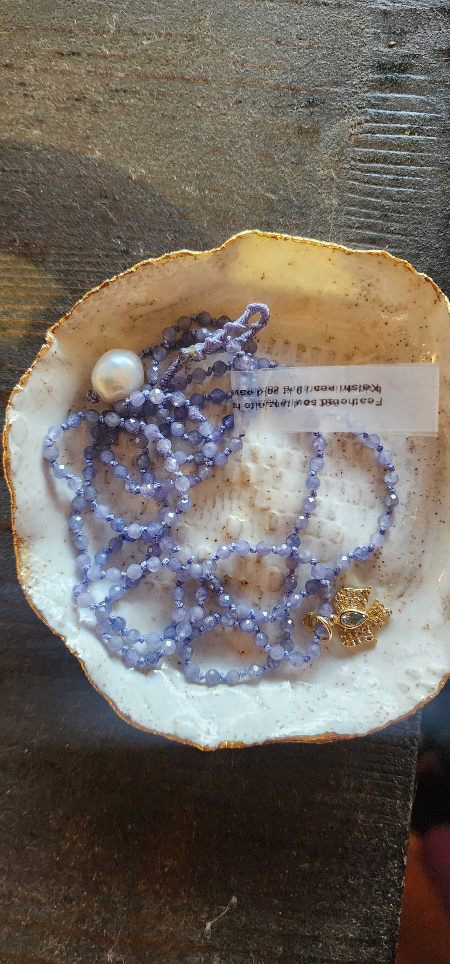 Hand knotted Tanzanite Necklace with Gold Bird