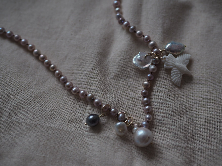 Pink Pearls With Hawk And Pearl Charms