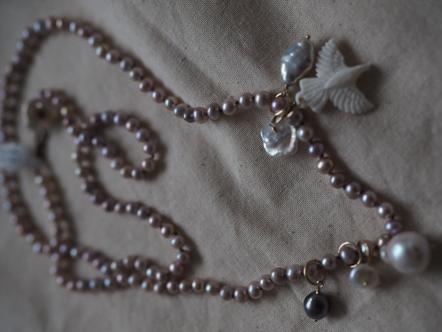 Pink Pearls With Hawk And Pearl Charms