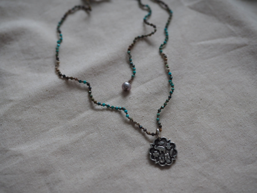 Hand Knotted Turquoise Necklace With Sterling Silver Sacred Medallion Charm