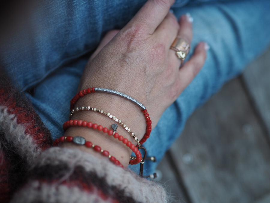 Coral stones bracelet with silver pave diamonds disk