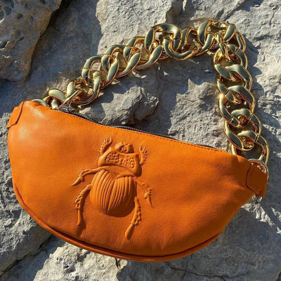 Gabriele Frantzen Orange Scarab Belt Bag on display
