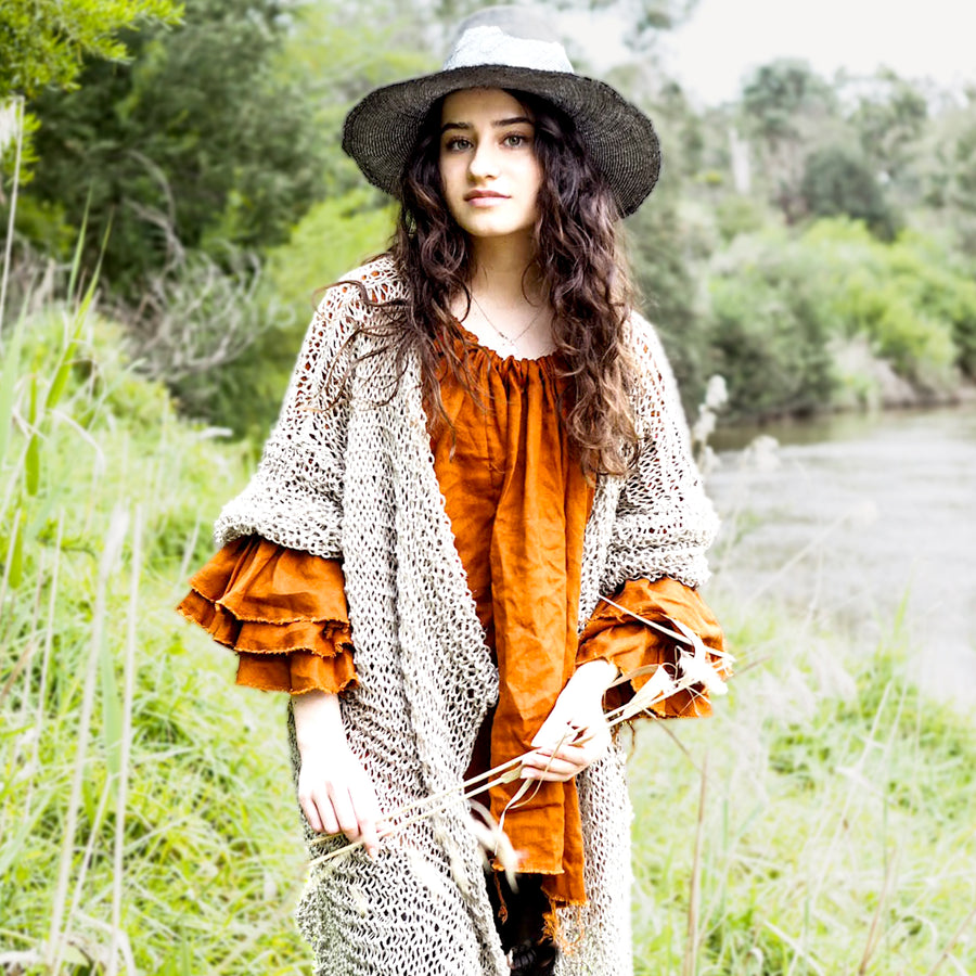 Model wearing Rust Linen Button Back Blouse under a coat | Amano by Lorena Laing