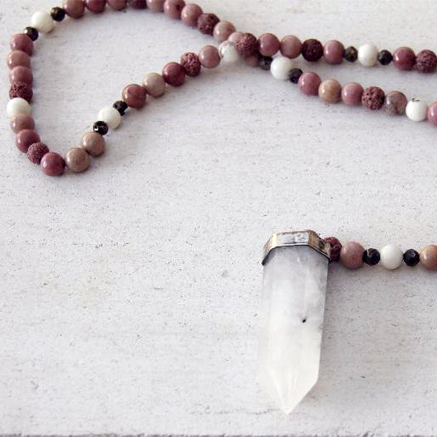 Close up of Emma Rea White Handcrafted Prayer Beads (Lava Stone, Rhodochrosite)