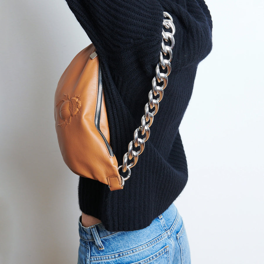 Model wearing a Gabriele Frantzen Cognac Scarab Belt Bag